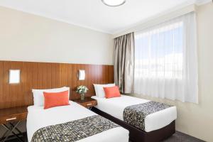 BreakFree Queanbeyan客房内的一张或多张床位