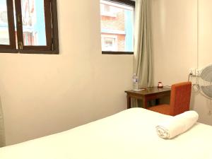Tempat tidur dalam kamar di Hotel Pala