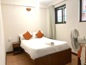 Tempat tidur dalam kamar di Hotel Pala