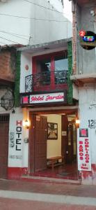 a building with a sign for a sushi restaurant at Hotel Jardín in Erongarícuaro