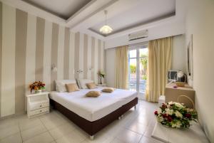 Postel nebo postele na pokoji v ubytování Pantheon Hotel + 28 fotografií