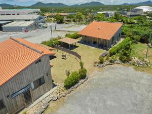 an overhead view of a house with an orange roof at Pension Snadun in Ginoza