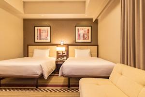 Postel nebo postele na pokoji v ubytování Hotel Sunroute Plaza Shinjuku