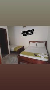 Ein Bett oder Betten in einem Zimmer der Unterkunft Hotel Majestic Mompox