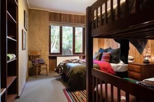 a bedroom with two bunk beds and a window at Gumtree Spring in Daylesford