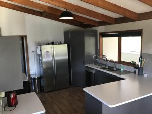 a large kitchen with a stainless steel refrigerator at Valley Views in Montrose