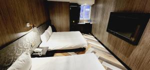 TV o dispositivi per l'intrattenimento presso 慶爾喜旅館西門捷運館Gugis Inn