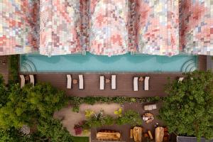 an overhead view of a building with plants and windows at Mambo Beach Resort in Nusa Penida