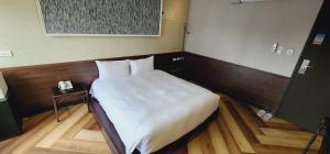 Letto o letti in una camera di 慶爾喜旅館西門捷運館Gugis Inn