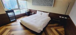 Letto o letti in una camera di 慶爾喜旅館西門捷運館Gugis Inn
