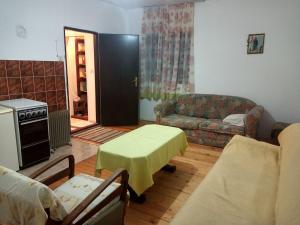 a living room with a couch and a table at Surcin center house in Surčin