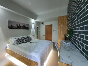 Postel nebo postele na pokoji v ubytování Irich residence South Samrong 6 Kms BTS-Pu Chao