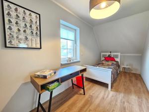 En eller flere senge i et værelse på Ferienhaus Golfkate Birdie