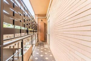 a hallway of a building with a balcony at Civico 2Cento - Vatican Suite in Rome