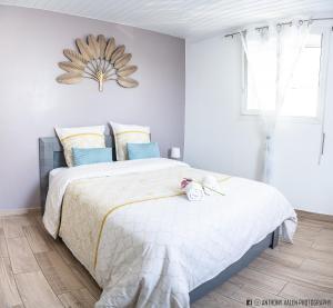 Ein Bett oder Betten in einem Zimmer der Unterkunft Chez Ti'Patrick