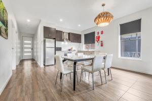 a kitchen and dining room with a table and chairs at Comfort Suites Clubarham Golf Resort in Barham