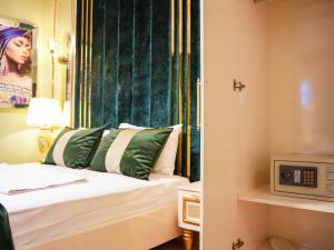 a hotel room with a bed and a microwave at WHITEMOON HOTEL SUİTES in Istanbul