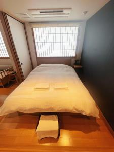 Voodi või voodid majutusasutuse Nplus Tokyo Akihabara Premium toas
