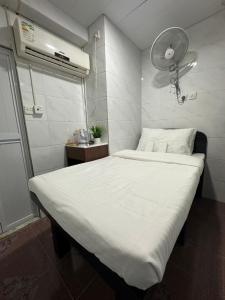 Ένα ή περισσότερα κρεβάτια σε δωμάτιο στο Mandarin Guest House
