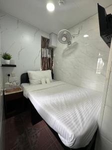 Ένα ή περισσότερα κρεβάτια σε δωμάτιο στο Mandarin Guest House