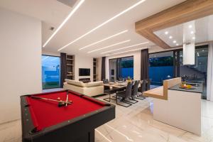 a living room with a red pool table at Stromboli in Sveti Petar
