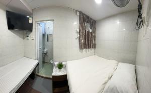 Ένα ή περισσότερα κρεβάτια σε δωμάτιο στο Mandarin Guest House