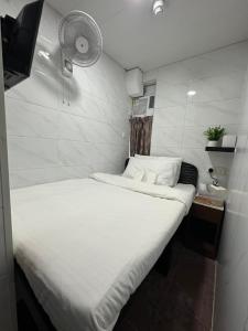 Ένα ή περισσότερα κρεβάτια σε δωμάτιο στο Mandarin Guest House