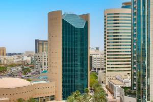 a view of a city skyline with tall buildings at Sheraton Dubai Creek Hotel & Towers in Dubai