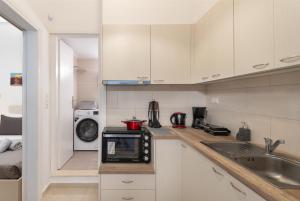 Kuchyň nebo kuchyňský kout v ubytování Anassa 9 Cozy Apartment