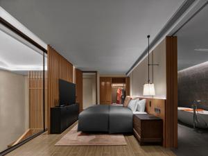Postel nebo postele na pokoji v ubytování Angsana Chengdu Wenjiang