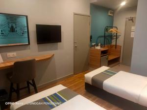 TV a/nebo společenská místnost v ubytování Singgah Pengerang Hotel