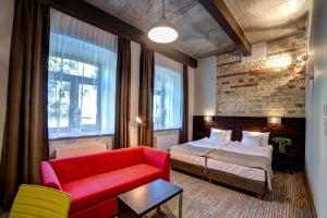Łóżko lub łóżka w pokoju w obiekcie Hotel Loft 1898