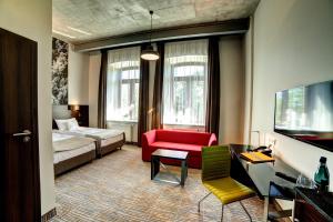 Łóżko lub łóżka w pokoju w obiekcie Hotel Loft 1898