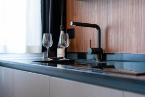 A kitchen or kitchenette at Officine Cavour - Appartamenti la Quercia Még 37 kép