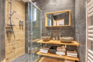 a bathroom with a shower and a sink at le clos grillet in La Chambre