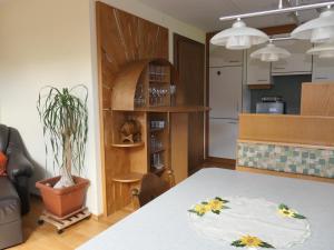 a kitchen and dining room with a table in a room at Fewo Schrottenbaum in Bürs