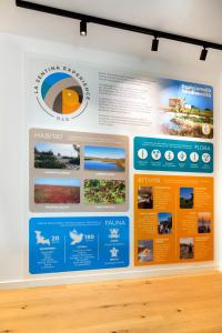 a display case with a poster on a wall at La Sentina Experience in San Benedetto del Tronto