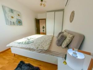 a small bedroom with a bed and a mirror at Old Town Bohemian Attic in Bucharest