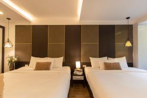 Voodi või voodid majutusasutuse Keypad Hotel - 24 Hang Ga toas