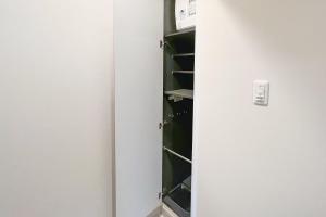 a closet with a white door and a shelf at Lafesta Higashikomagata in Tokyo