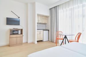 A kitchen or kitchenette at Excelsior Estudios & Apartamentos