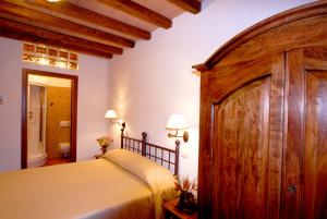 Un pat sau paturi într-o cameră la Hotel Ristorante da Righetto