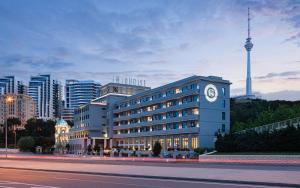 a building with a clock on the side of it at Sheraton Baku Intourist in Baku