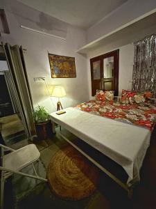 a bedroom with a large bed in a room at Sanjana's stay in Udaipur