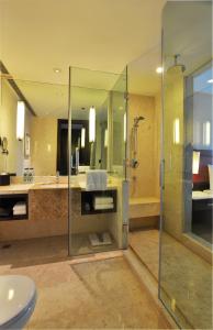 a bathroom with a shower and a sink at Courtyard by Marriott Hangzhou Wulin in Hangzhou