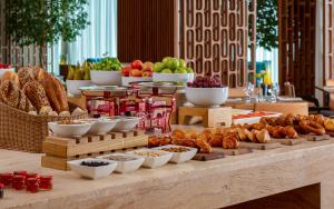 a buffet with different types of food on a table at Sheraton Baku Intourist in Baku