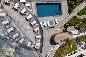 an overhead view of a parking lot with a pool at Crowne Plaza - Marseille Le Dôme in Marseille