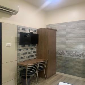 TV a/nebo společenská místnost v ubytování Hotel Royal Residency - Chembur