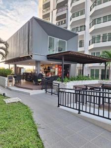a building with a house with a balcony at Mantra condominium in Ban Tha Fat