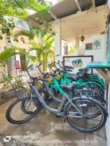 a row of bikes parked in a garage at H.Said Homestay in Gili Trawangan